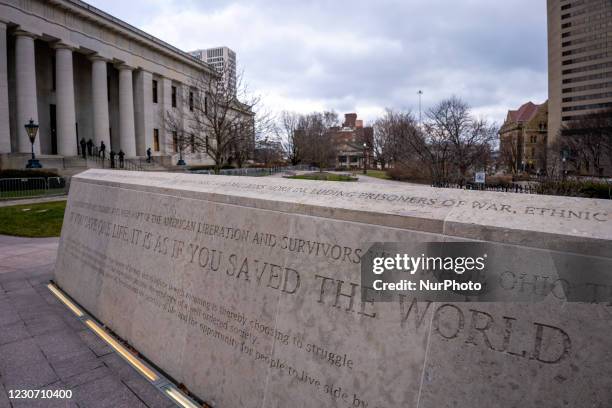 Sign honoring fallen military personnel is seen as members of Antifa march from City Hall to the Ohio Statehouse after President Joe Biden was sworn...