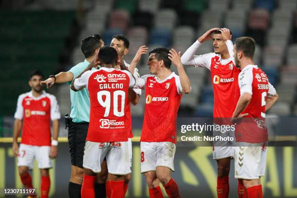 Referee Fábio Verissimo surrounded by SC Braga players while pointing to the penalty mark during the Allianz Cup semi final game between SL Benfica...