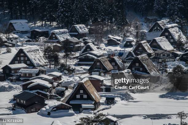 Blanket of snow covers traditional buildings on January 21, 2021 in Shirakawago, Japan. The UNESCO World Heritage-listed village is hugely popular...