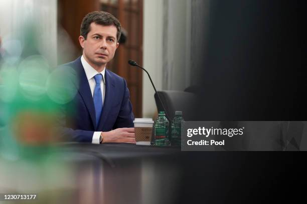 Pete Buttigieg, U.S. Secretary of transportation nominee for U.S. President Joe Biden, listens during a Senate Commerce, Science and Transportation...