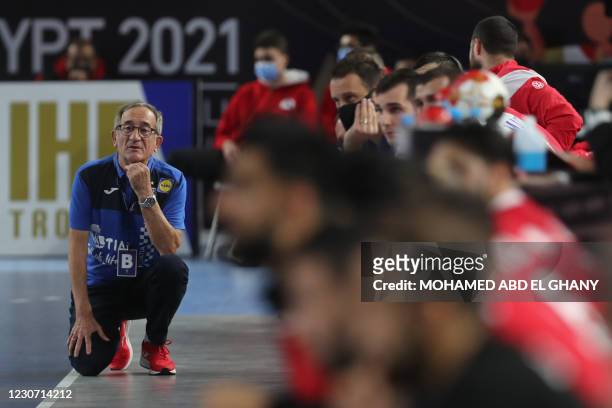 Croatia's coach Lino Cervar kneels on the sideline during the 2021 World Men's Handball Championship match between Group II teams Croatia and Bahrain...