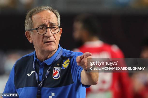 Croatia's coach Lino Cervar gestures during the 2021 World Men's Handball Championship match between Group II teams Croatia and Bahrain at the Cairo...