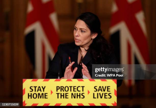 Britain's Home Secretary Priti Patel, speaks during a media briefing on the COVID-19 pandemic in Downing Street on January 21, 2021 in London,...