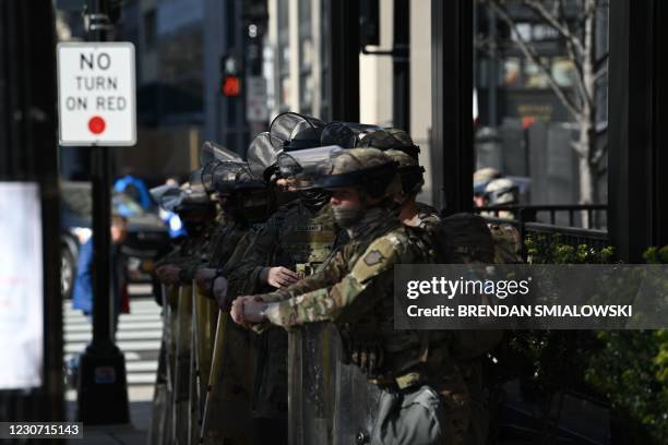 National Guard soldiers prepare to board a bus in Washington, DC, on January 21 one day after the inauguration of US President Joe Biden.