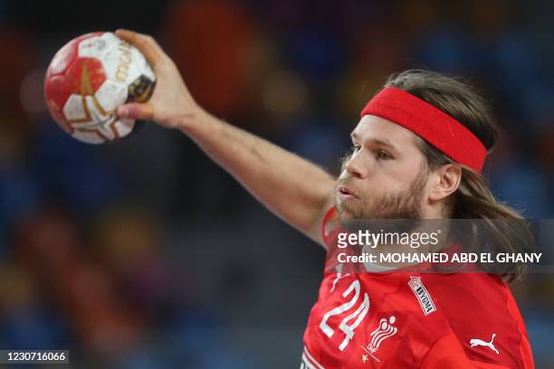 Denmark's left back Mikkel Hansen shoots during the 2021 World Men's Handball Championship match between Group II teams Denmark and Qatar at the...