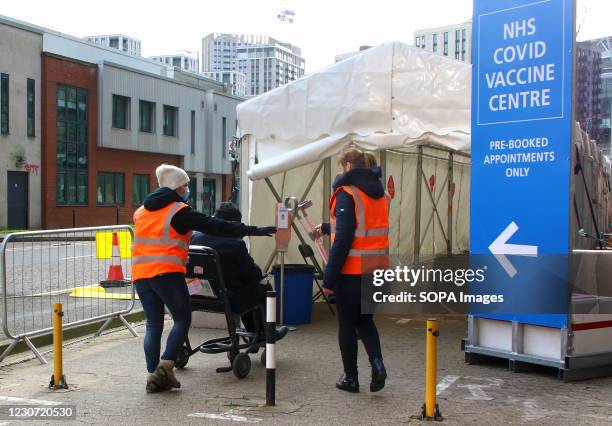 Medical steward checks in people into the vaccination centre. A steady stream of elderly people with pre-booked appointments at the new Covid-19...