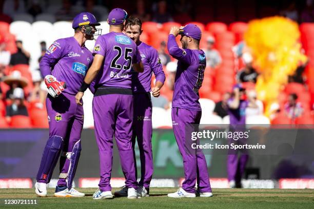 Hobart Hurricanes celebrate a wicket during the Big Bash League cricket match between Hobart Hurricanes and Perth Scorchers at Marvel Stadium on...