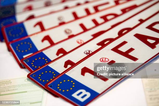 January 2021, Bavaria, Passau: Counterfeit Belgian license plates seized by the Bavarian Border Police are presented at a press conference to present...