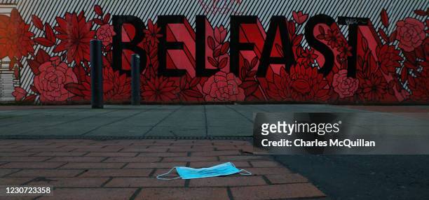 Disused face mask can be seen on a city centre street on January 20, 2021 in Belfast, Northern Ireland. The province initially went in to a six-week...