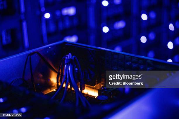 Cables inside a draw housing graphics processing units used to mine the Ethereum and Zilliqa cryptocurrencies at the Evobits crypto farm in...