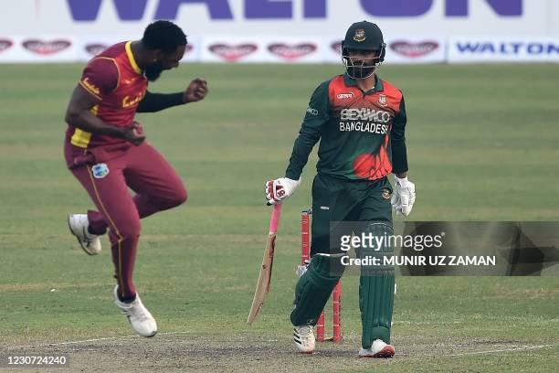 West Indies' Raymon Reifer celebrates after taking the wicket of Bangladesh's captain Tamim Iqbal during the second one-day international cricket...