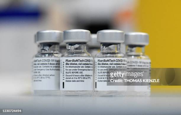 Empty vials of the Pfizer-BioNTech Covid-19 disease vaccine are displayed at the regional corona vaccination centre in Ludwigsburg, southern Germany,...