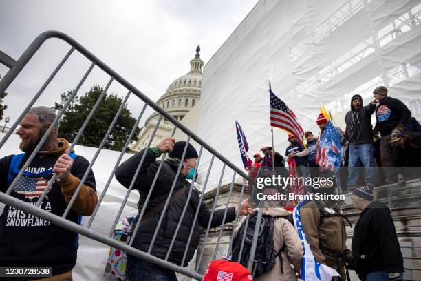 Trump supporters clash with police and security forces as people try to storm the US Capitol in Washington D.C on January 6, 2021. Demonstrators...