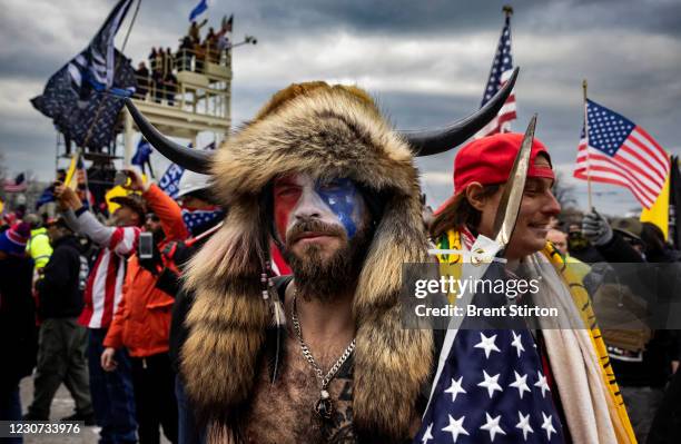 Jacob Anthony Angeli Chansley, known as the QAnon Shaman, is seen at the Capital riots. On January 9, Chansley was arrested on federal charges of...