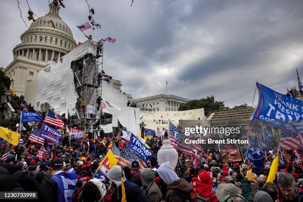 Trump supporters clash with police and security forces as people try to storm the US Capitol on January 6, 2021 in Washington, DC. Demonstrators...