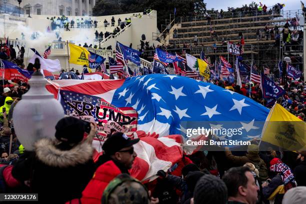 Trump supporters clash with police and security forces as people try to storm the US Capitol on January 6, 2021 in Washington, DC. Demonstrators...