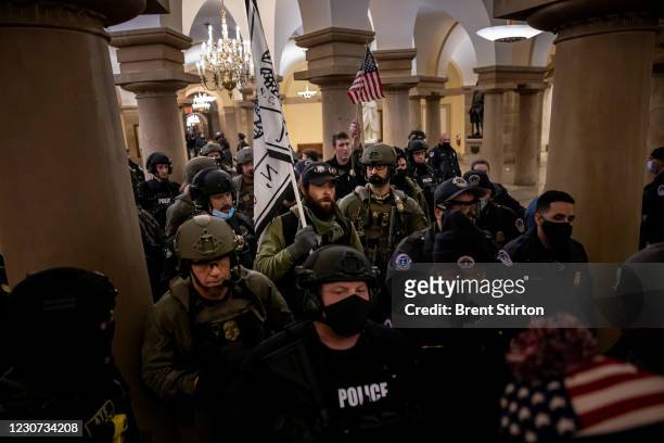 And ATF law enforcement push out supporters of US President Donald Trump as they protested inside the US Capitol on January 6 in Washington, DC. -...