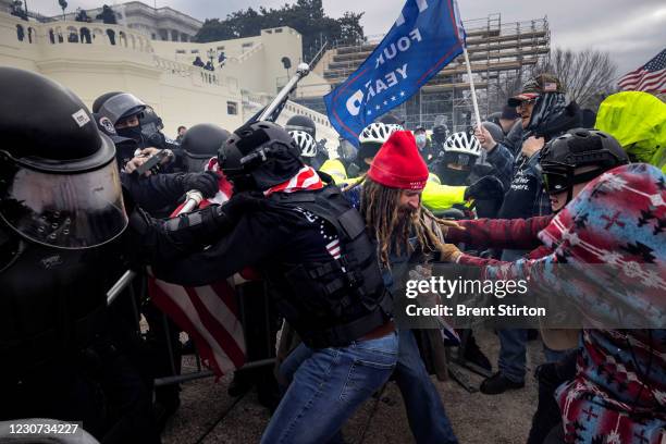 Trump supporters clash with police and security forces as people try to storm the US Capitol on January 6, 2021 in Washington, DC. Demonstrators...