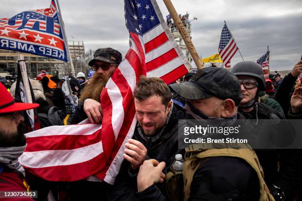 Trump supporters clash with police and security forces as people try to storm the US Capitol on January 6, 2021 in Washington, DC. Demonstrators...