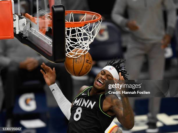 Jarred Vanderbilt of the Minnesota Timberwolves reacts after dunking the ball against the Atlanta Hawks during the first quarter of the game at...