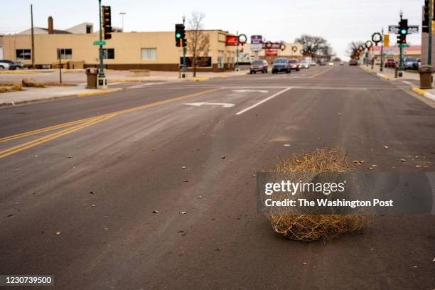 Tumbleweed rolls across Main Street in Mitchell, South Dakota on Monday, November 23, 2020. Opponents of a citywide mask mandate under consideration...