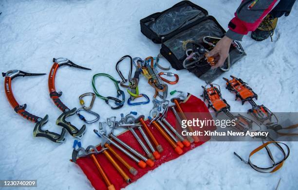 Jan. 12, 2021 -- Huang Huang packs his tools after climbing at a canyon on the outskirts of Urumqi, northwest China's Xinjiang Uygur Autonomous...