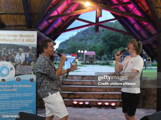 January 2021, Namibia, Windhuk: The pop singers Mickie Krause and Peter Wackel perform at a charity concert under the motto "Stars under African...