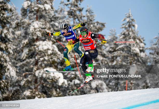 Canada's Reece Howden and Germany's Niklas Bachsleitner compete during the semifinal heat 2 of the men's Ski Cross fieventnal at the FIS Freestyle...