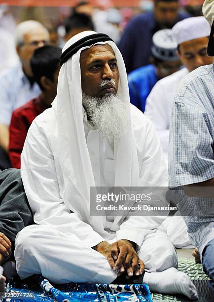 Muslims man sits during a special Eid ul-Fitr morning prayer at the Los Angeles Convention Center on August 30, 2011 in Los Angeles, California. The...
