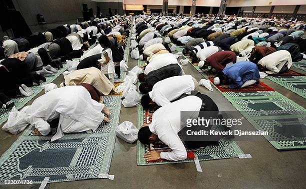 Muslims pray during a special Eid ul-Fitr morning prayer at the Los Angeles Convention Center on August 30, 2011 in Los Angeles, California. The...