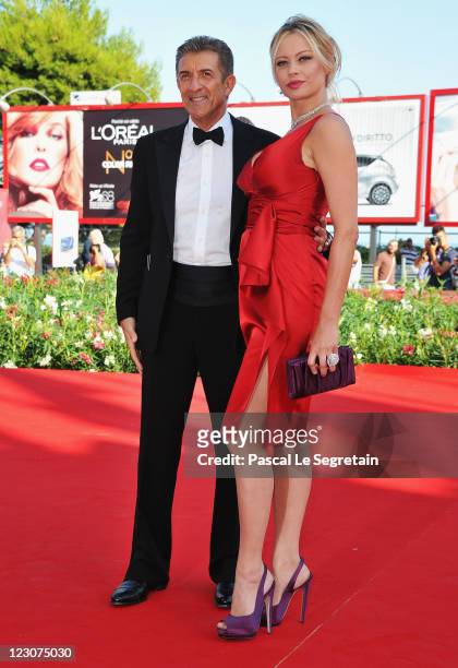 Director/producer Ezio Greggio and actress Anna Falchi attend the "Box Office 3D" premiere during the 68th Venice Film Festival at Palazzo del Cinema...