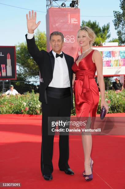 Director and Producer Ezio Greggio and actress Anna Falchi attends "Box Office 3D" premiere during the 68th Venice International Film Festival at...