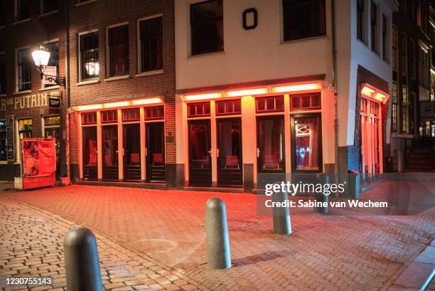Stores are closed along the red light district on January 23, 2021 in Amsterdam, Netherlands. Following a majority vote by lawmakers to instate an...