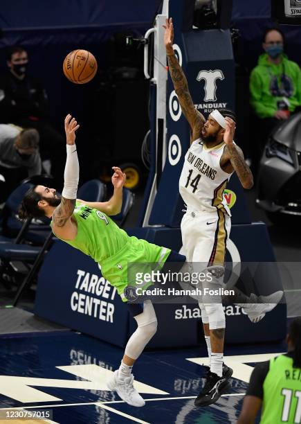 Brandon Ingram of the New Orleans Pelicans fouls Ricky Rubio of the Minnesota Timberwolves while shooting the ball during the third quarter of the...