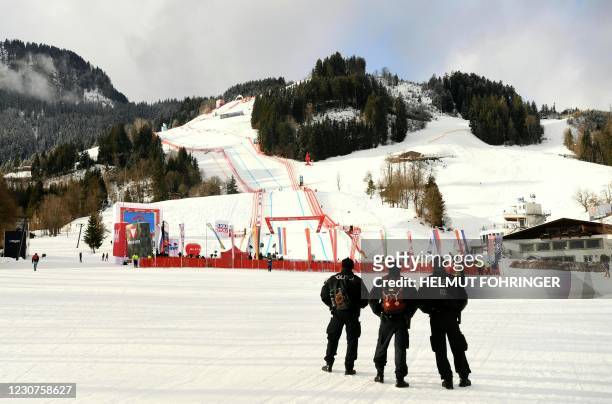 Austrian policemen patrol near the Streif, downhill course of the FIS Men's Alpine Ski World Cup, also known as Hahnenkamm race, in Kitzbuehel,...