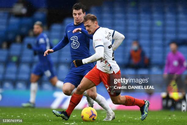 Luton Town's English midfielder Kiernan Dewsbury-Hall vies with Chelsea's English midfielder Mason Mount during the English FA Cup fourth round...