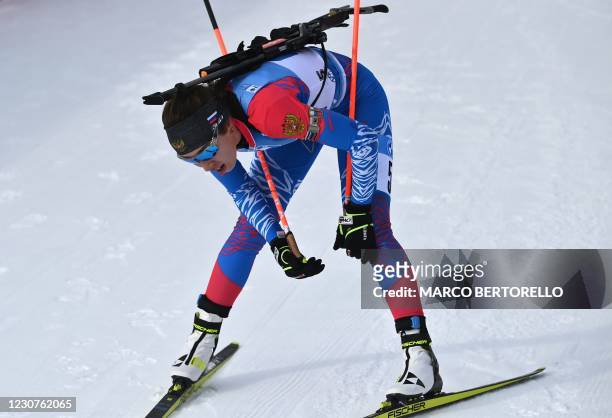 Russian Ulyana Kaysheva reacts after she crossed the finish for Russia to win the IBU Biathlon World Cup Women's 4 X 6 km Relay Competition in...