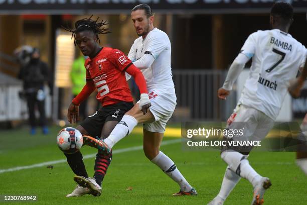 Rennes' French midfielder Eduardo Camavinga fights for the ball with Lille's Turkish midfielder Yusuf Yazici during the French L1 football match...