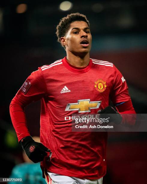 Marcus Rashford of Manchester United celebrates scoring a goal to make the score 2-1 during the Emirates FA Cup Fourth Round match between Manchester...