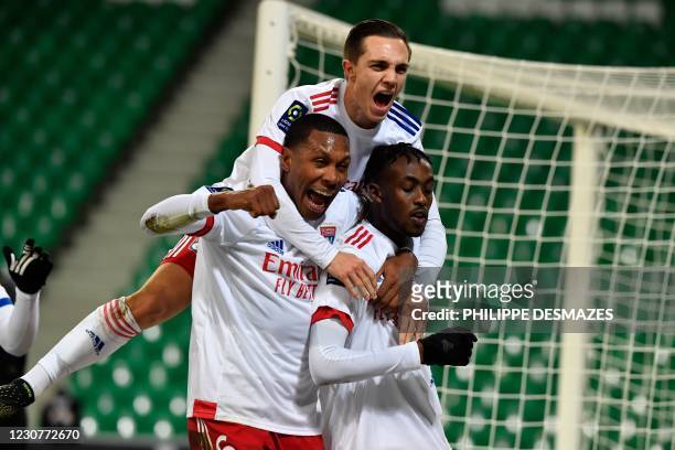 Lyon's Zimbabwean forward Tino Kadewere is congratulated by teammates, including Lyon's Brazilian defender Marcelo after scoring a goal during the...
