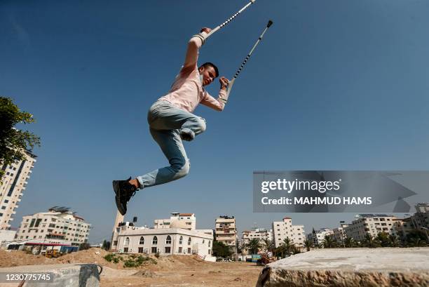 Mohamed Aliwa, a Palestinian youth whose leg was amputated near the knee in 2018 after he was hit by Israeli army fire during protests along the...