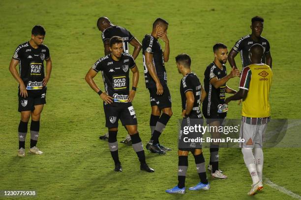 Players of Botafogo react after losing the match between Fluminense and Botafogo as part of the Brasileirao Series A at Sao Januario Stadium on...