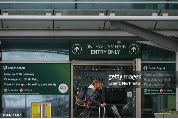 Travelers seen at the entrance to Terminal 2 at Dublin Airport during Level 5 Covid-19 lockdown. On Sunday, 24 January in Dublin, Ireland.