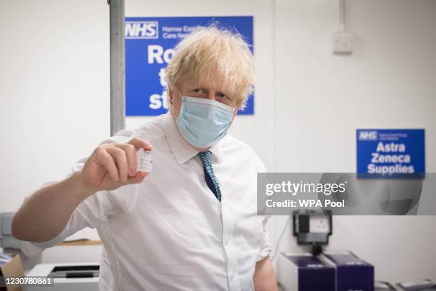 British Prime Minister Boris Johnson sees how a dose of the Oxford/Astra Zeneca Covid 19 vaccine is prepared for a mobile vaccination centre at...