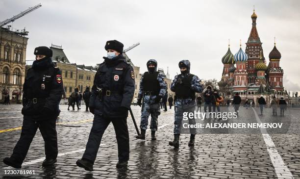 Police officers and the Russian National Guard servicemen patrol on Red Square in central Moscow on January 25, 2021. - The Kremlin on Sunday accused...