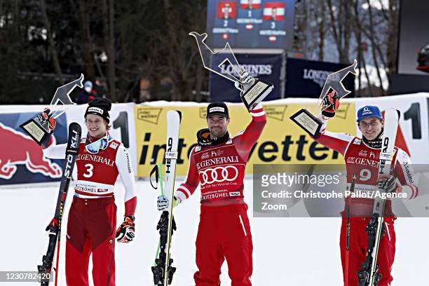 Marco Odermatt of Switzerland takes 2nd place, Vincent Kriechmayr of Austria takes 1st place, Matthias Mayer of Austria takes 3rd place during the...
