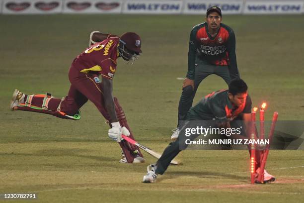 Bangladesh's Mohammad Saifuddin runs out West Indies' Alzarri Joseph during the third and final one-day international cricket match between...