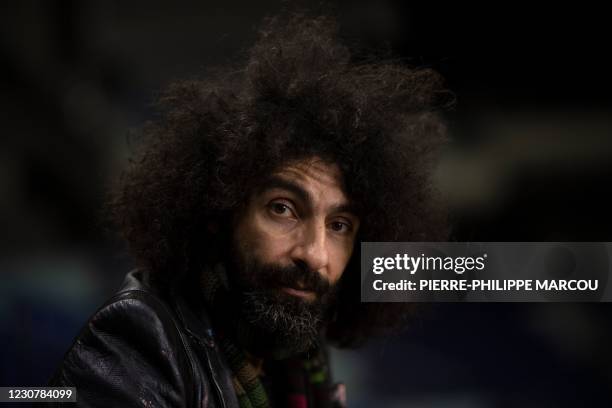 Armenian-Spanish violinist Ara Malikian poses during an AFP interview at the WiZink Center in Madrid on January 25, 2021. - In the garage where he...