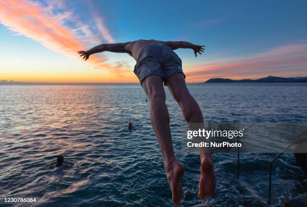 Early morning swimmers at the Vico bathing place, Hawk Cliff, in Dalkey, during Level 5 Covid-19 lockdown. On Monday, 25 January in Dublin, Ireland.