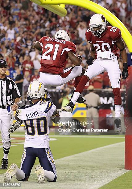 Cornerbacks Patrick Peterson and A.J. Jefferson of the Arizona Cardinals celebrate after wide receiver Malcom Floyd of the San Diego Chargers dropped...